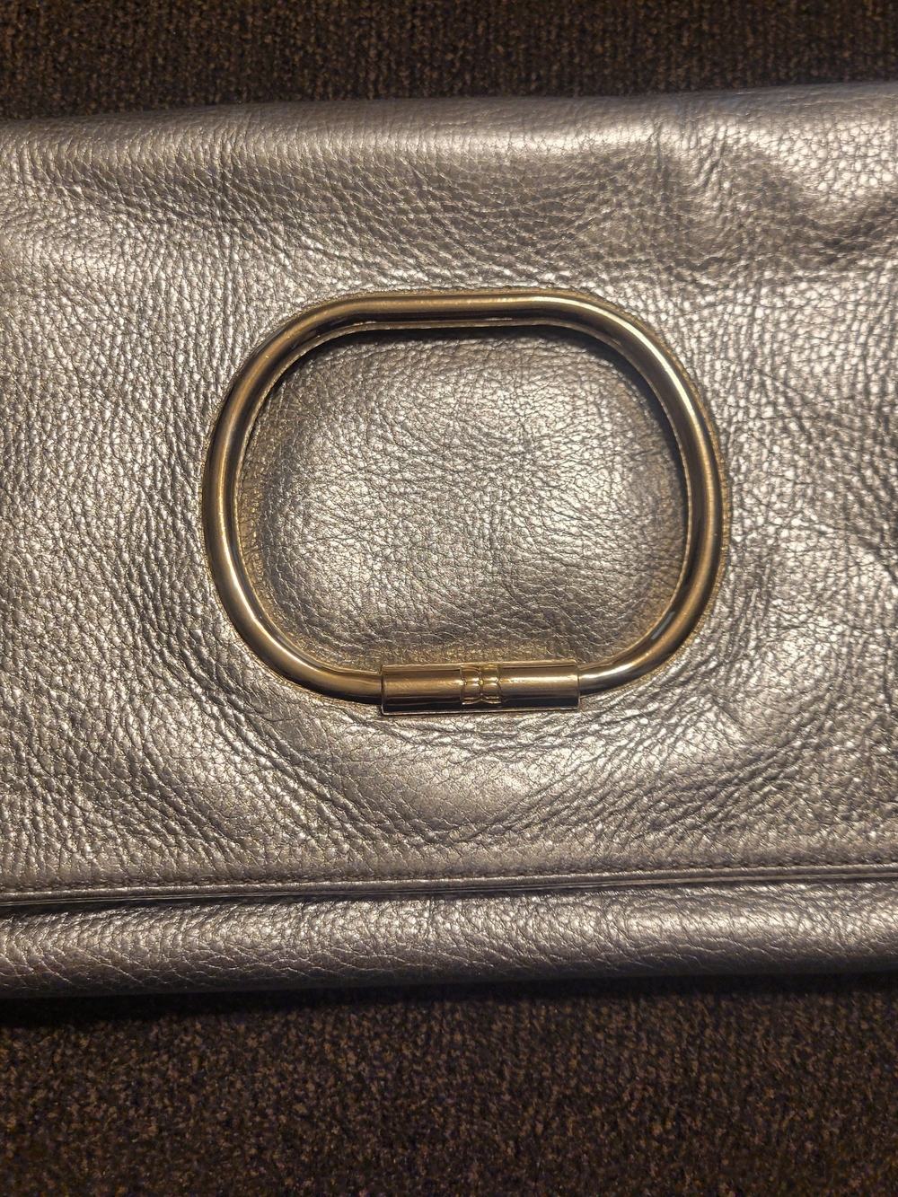 BCBGMaxAzria Metallic Silver Leather Clutch with Gold Ring Detail